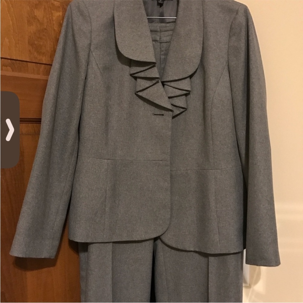 Kasper 2-piece pants suit.
Kasper Gray Blazer with Ruffled Collar and pants.